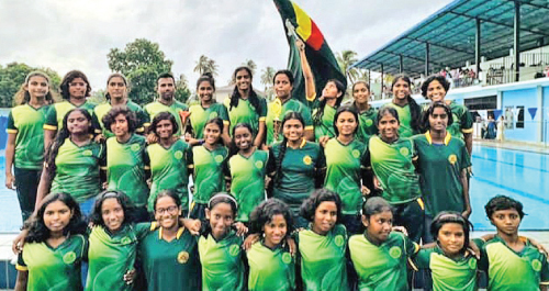 Maliyadeva Girls College Swimming Team flaunting their college flag at the iconic Sir Albert F Peiris Sports Complex, Wennappuwa.     