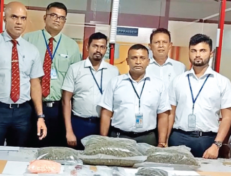 Customs officers with the seized narcotics. 
