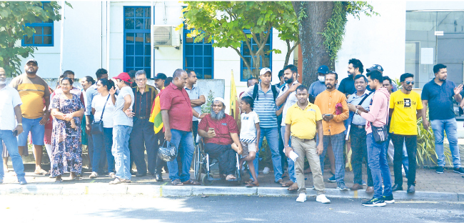 Cricket fans protesting outside SLC headquarters demanding legal action against SLC officials for their alleged misdeeds. Picture by Wasitha Patabendige