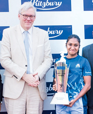 His Excellency Andrew Patrik - British High Commissioner to Sri Lanka, with Shanella Seneviratne (Gateway College Colombo) - Best Female Athlete.    