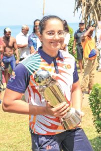 Galina Basnayake proudly displays her trophy after emerging victorious as the Best Open Women Para Swimmer at the Mount Lavinia 85th Two-mile Sea Swim.     