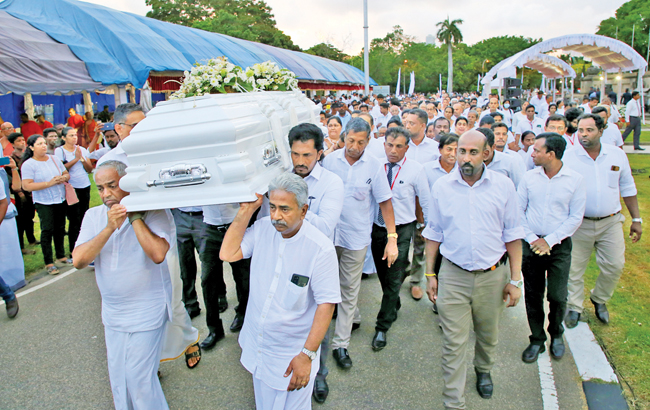 The coffin being taken for the final rites.