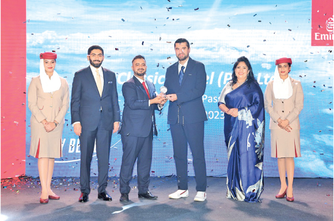 Managing Director of Classic Travel, Saif Yusoof receiving award at Emirates Awards Night.